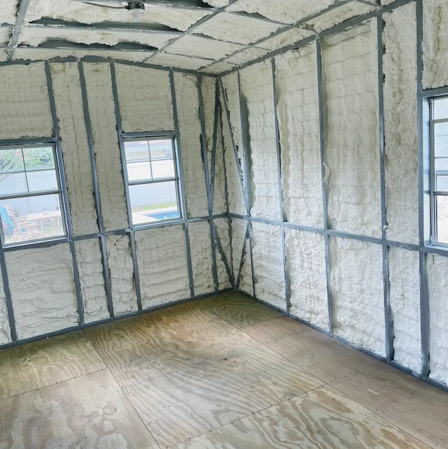 Closed-cell spray foam insulation applied to wall cavities in a residential project in Hewitt